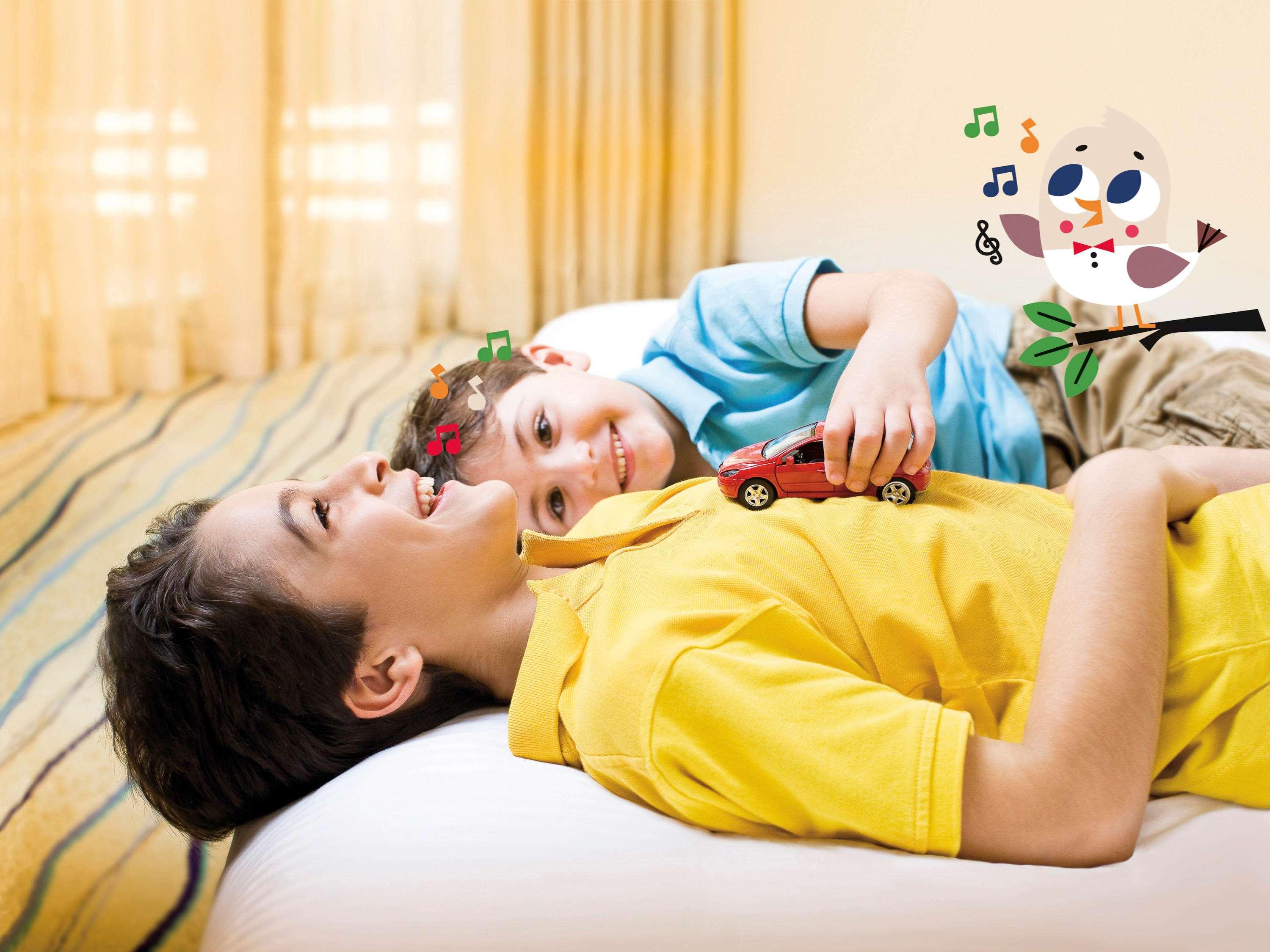 Moevenpick Hotel & Casino Malabata Tanger Εξωτερικό φωτογραφία A child with autism playing with a toy